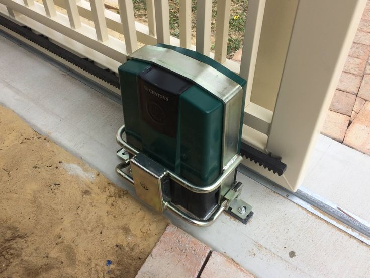 A sliding gate motor we fitted at a driveway, mounted on its concrete plinth.